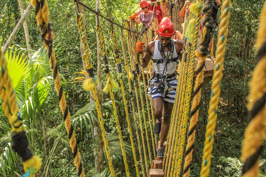 Group on rope bridge in Cancun