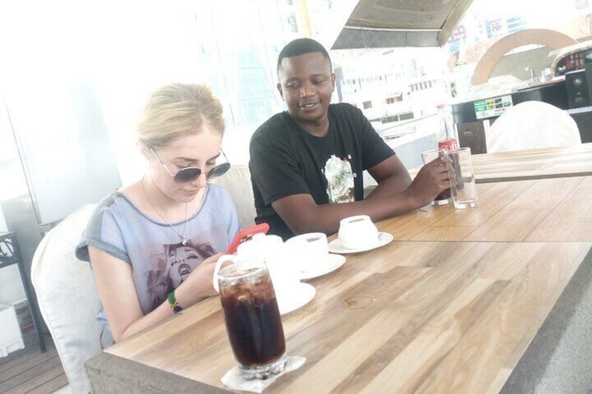 Taking a break in our tour by having coffee and coke
