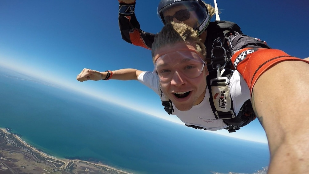 Guests smiling on the tandem skydive over Bells Beach, Torquay