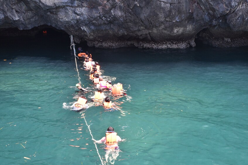 Group snorkeling at Emerald Cave on Koh Mook