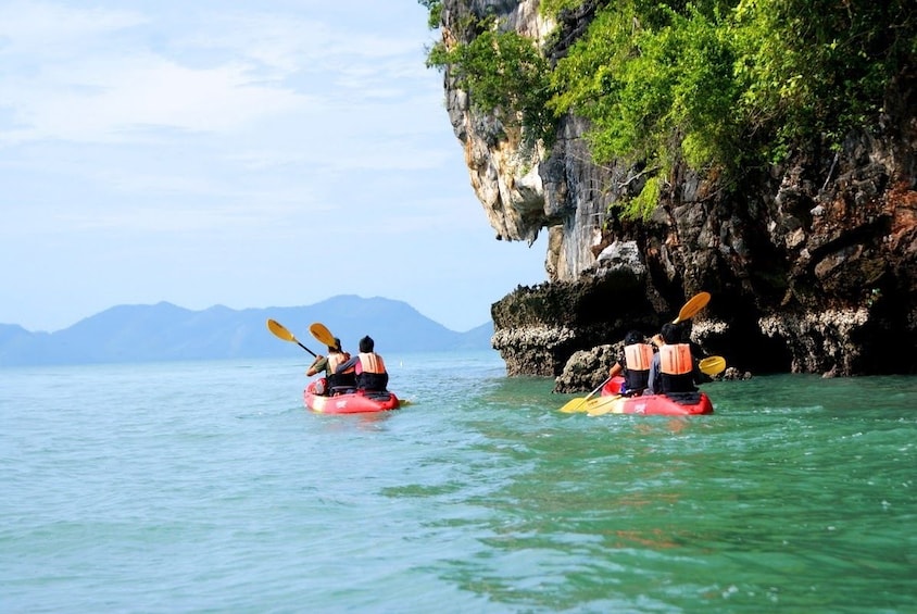 Group kayaking during the day in Krasom