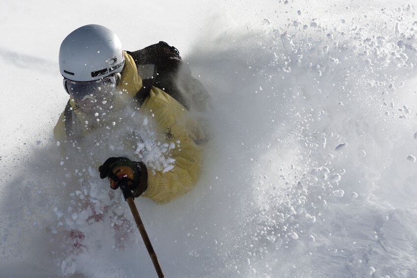 Snow picking up as skier goes downhill in La Parva