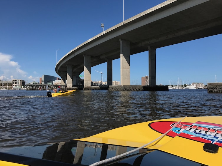Views of the foot of a bridge from a speedboat on Charleston Harbor 