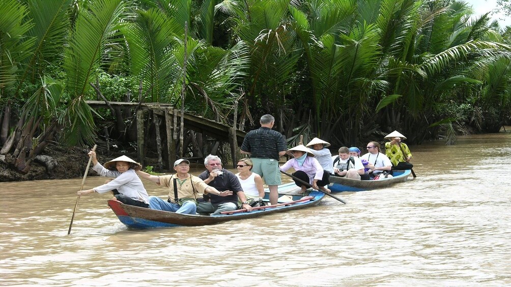 Tourist groups on a river experience along the Mekong Delta 