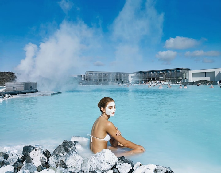 Woman sits in Blue Lagoon in Iceland