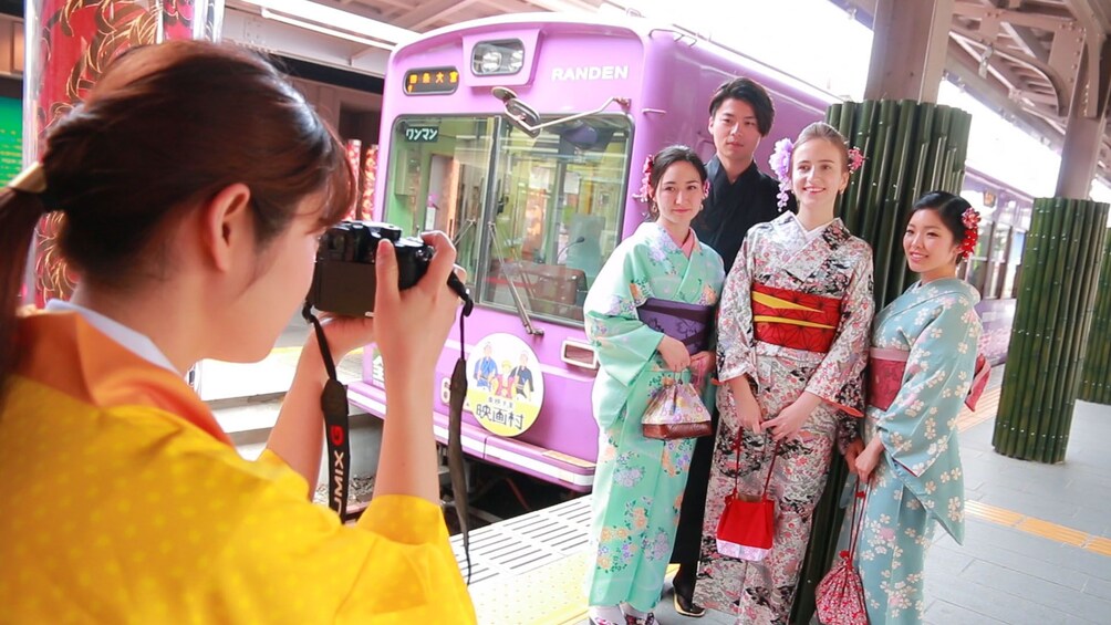 Group taking photo next to a bus in Japan 