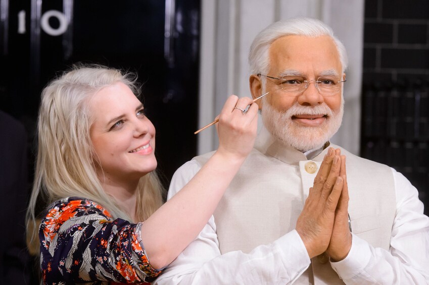 Artist painting wax figure at Madam Tussaud's in Delhi