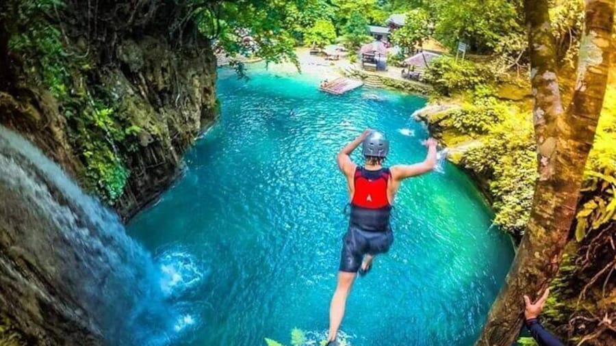 Experience the adrenaline rush as you jump through the turquoise waters in canyoneering badian.