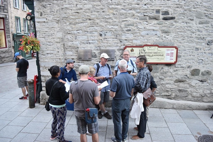 Show item 3 of 6. Tour guide with group in Quebec