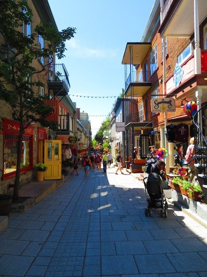 Show item 4 of 6. Pedestrian street lined with shops in Quebec