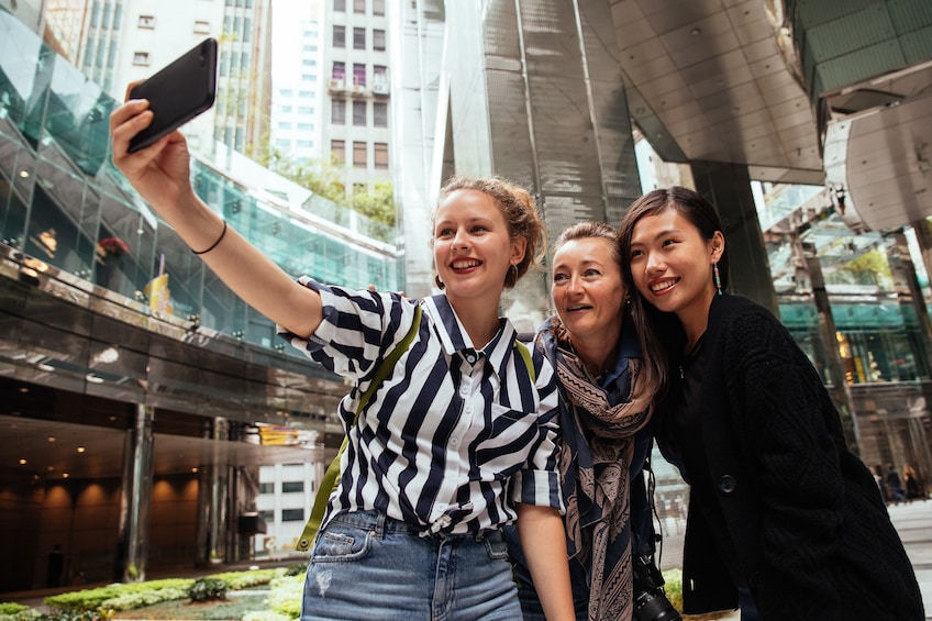 Woman taking a selfie with a mobile phone in Hong Kong 