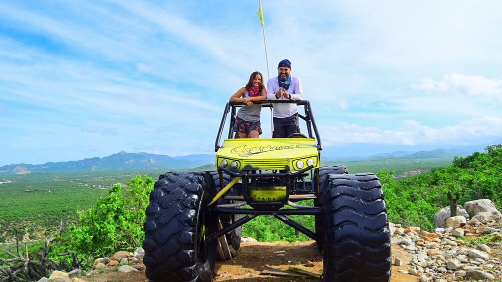 Couple standing on a UTV in Los Cabos 
