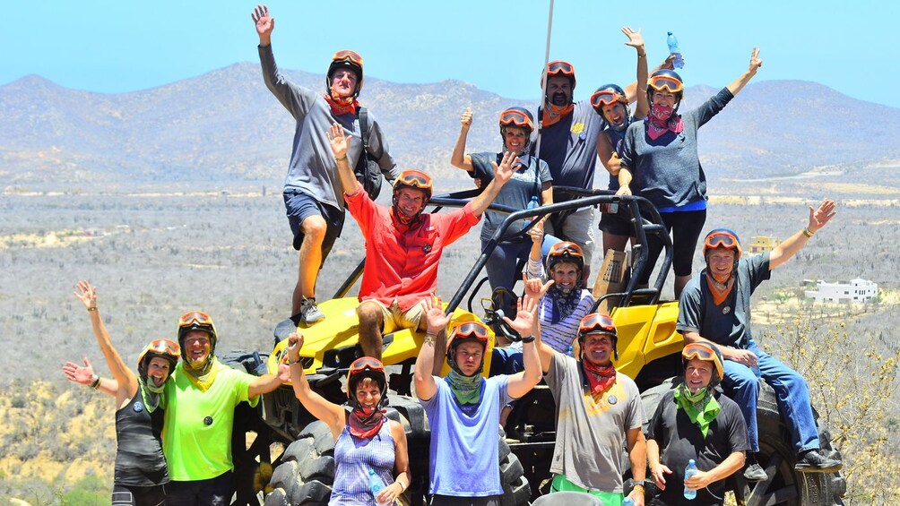 Group on an ATV for a photo in Los Cabos
