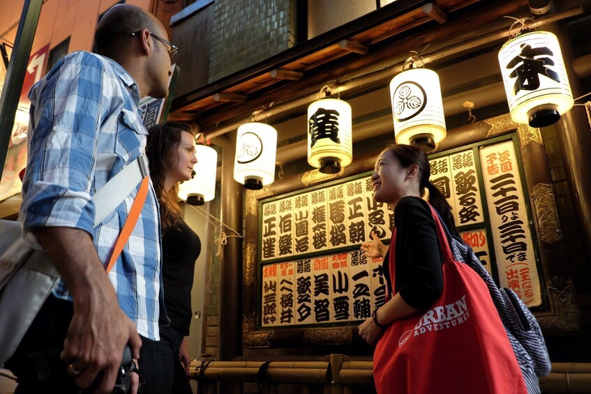 Group and guide walking the streets in Shinjuku 