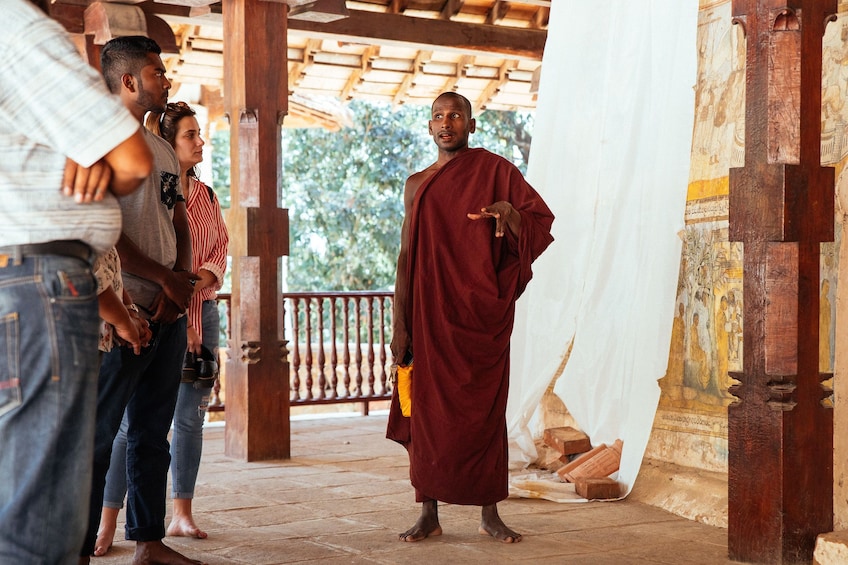 Monk talking to tourists in Sri Lanka
