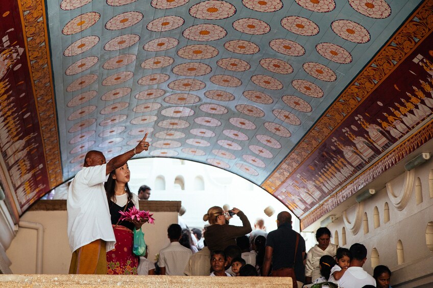 Tourists taking photos of the beautiful artwork in Sri Lanka