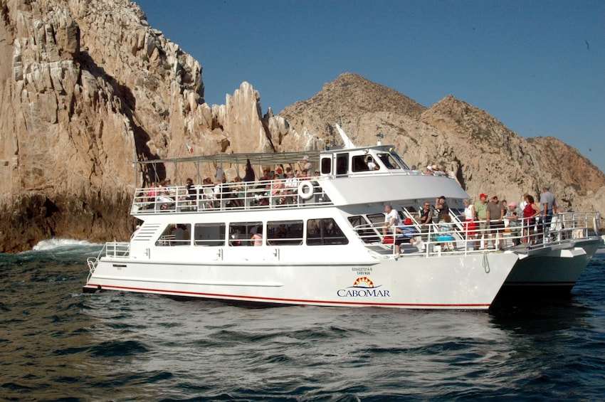 Boat carrying passengers in Cabo San Lucas bay 