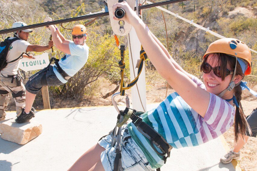 Man and woman just getting ready to zip line above Costa Azul Canyon