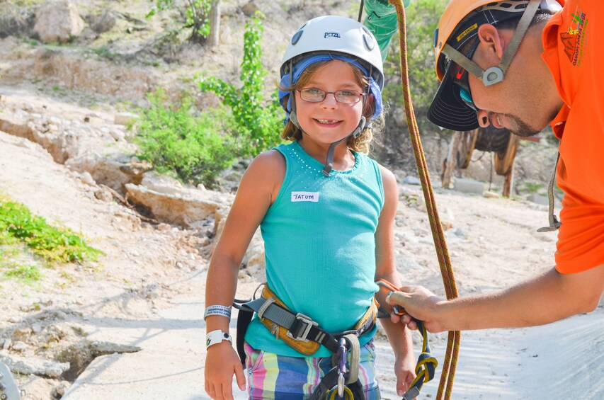 Girl getting ready to zip line above Costa Azul Canyon