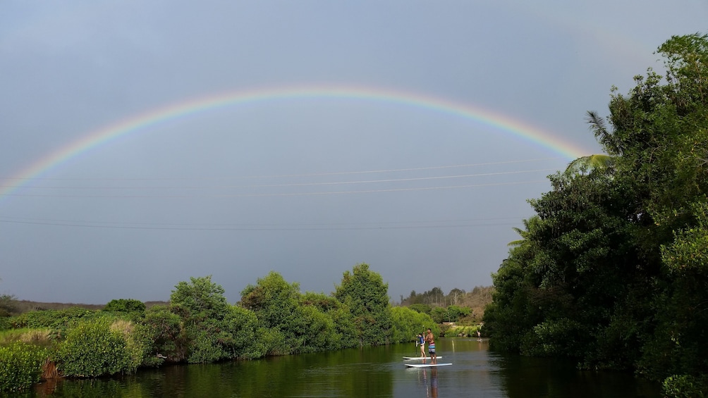 Rainbow over Haleiwa while stand up paddle boarding 