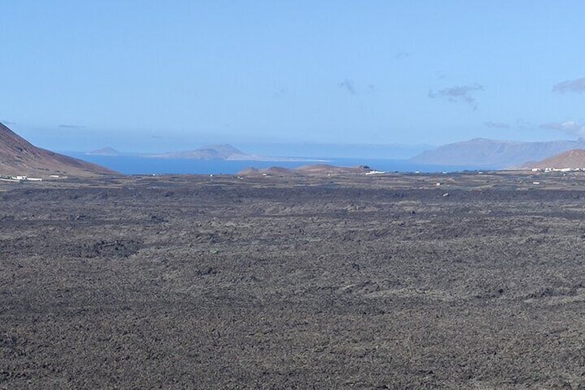 Trekking between Timanfaya Volcanoes in a small group