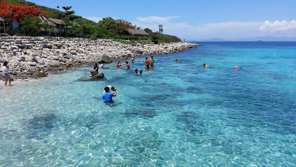 People swim off the coast of Hon Mun Island