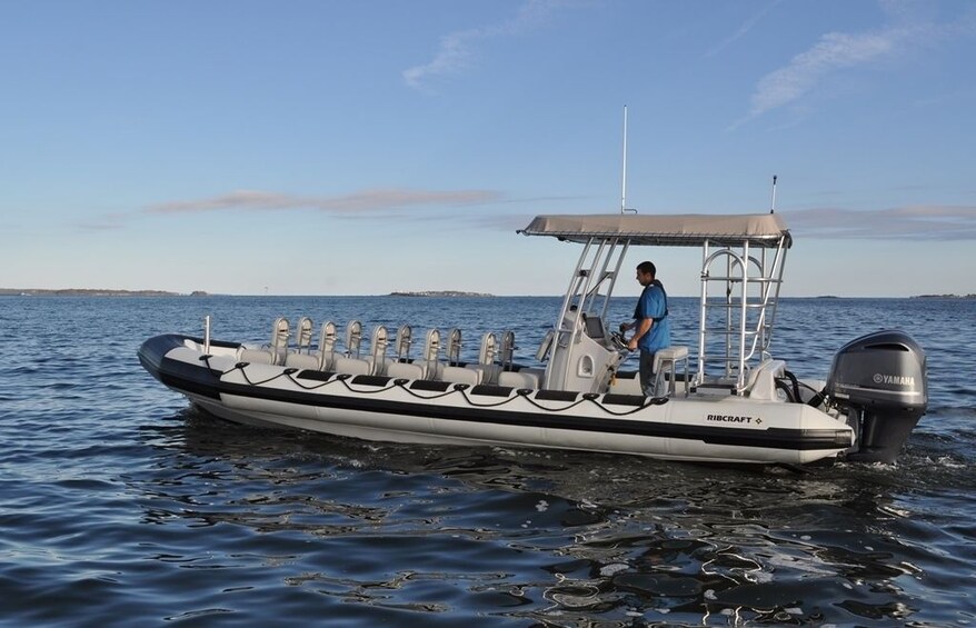 Man operating a powerboat in Waimea