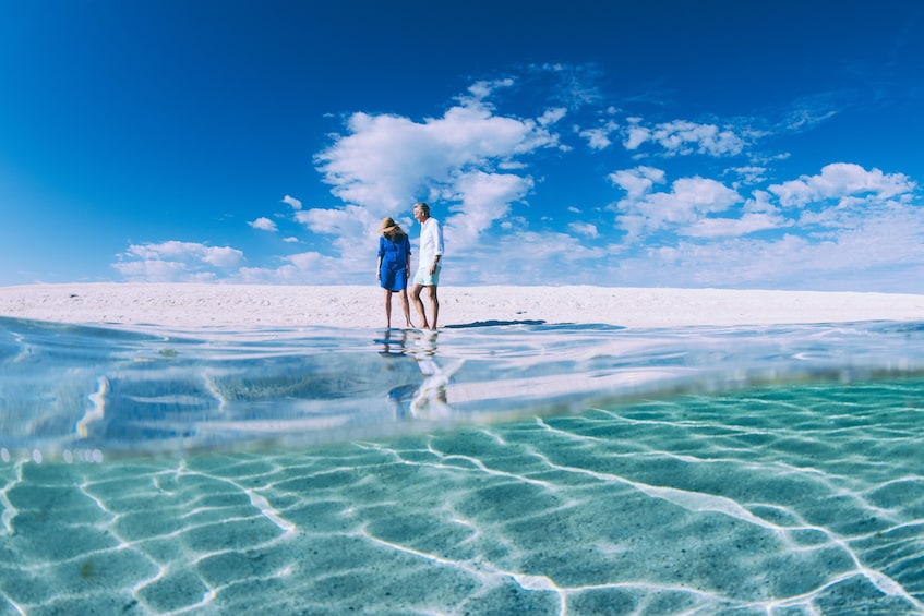 Couple walking on the beach in Australia