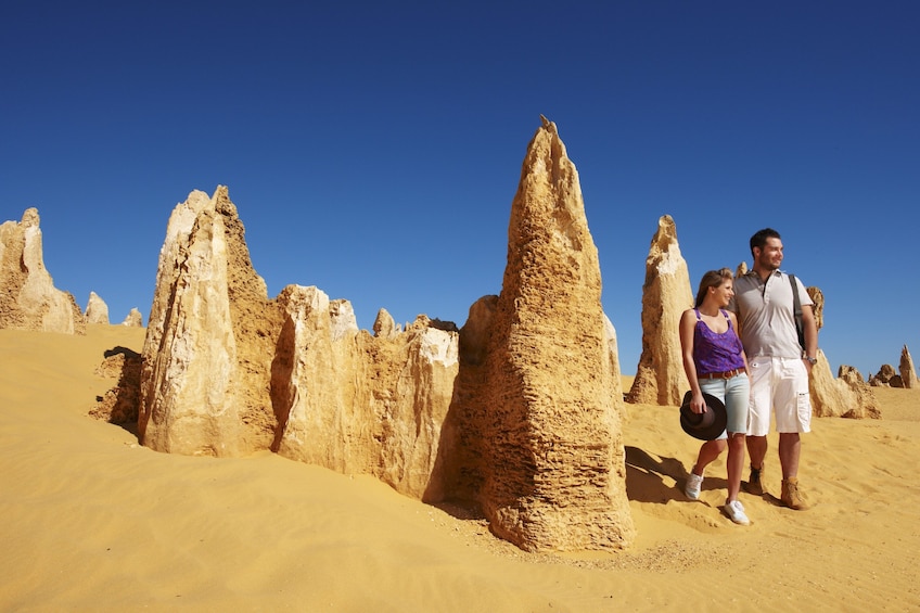 Couple walking near interesting rock formations in Australia