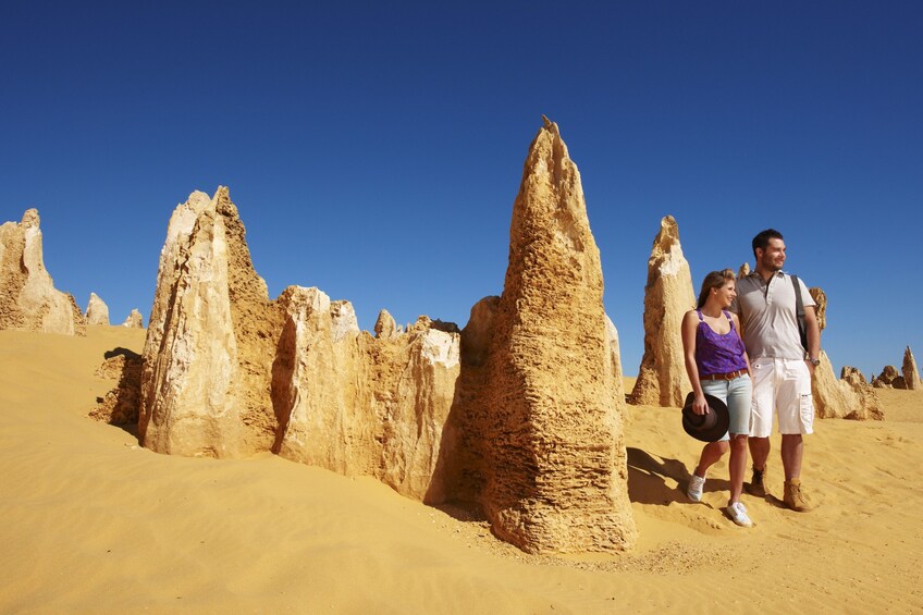 Couple walking near interesting rock formations in Australia