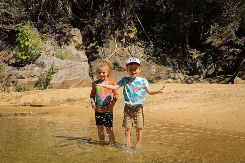 A Guided 30 minute Hike through a river to a waterfall is included.