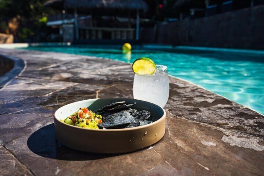 Paradise = Fresh made guacamole blue corn chips and fresh drinks.