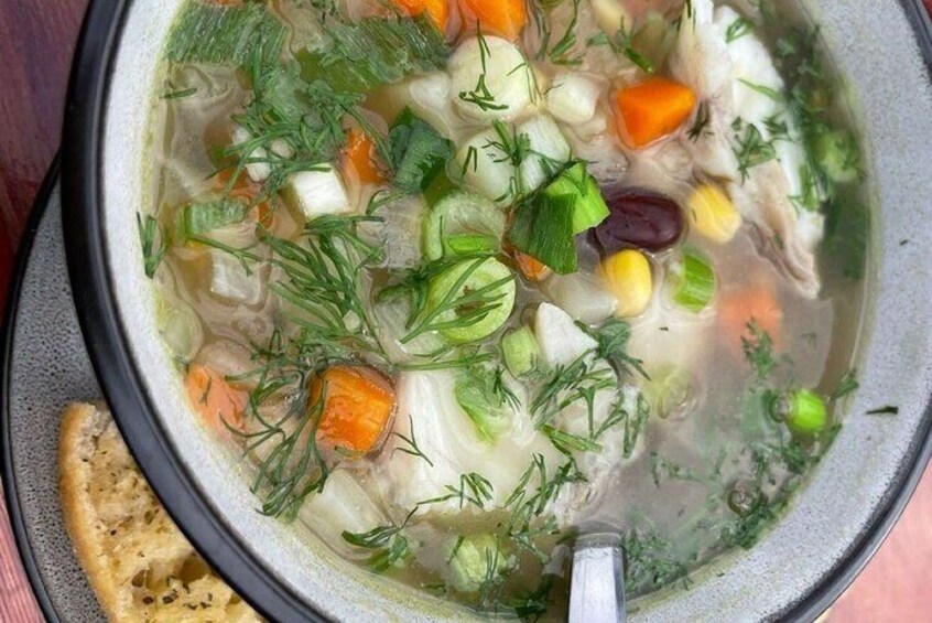 Fresh fish herb soup with bread