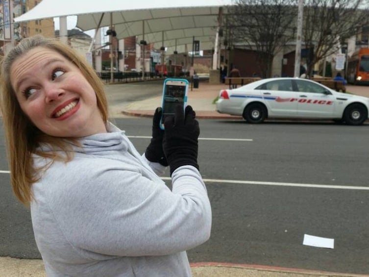 Show item 2 of 4. Lady taking photo with a cellphone