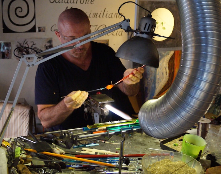Artist working with glass in Venice