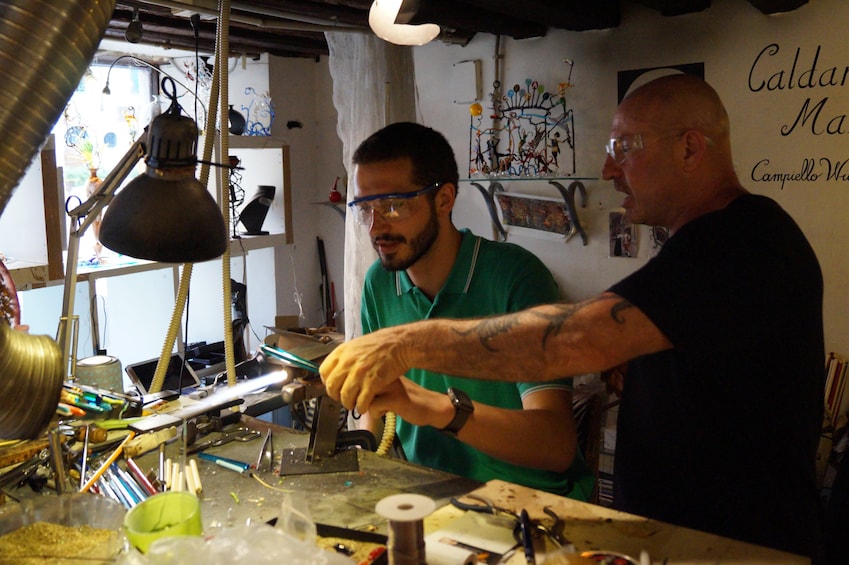 Artist working with glass in Venice