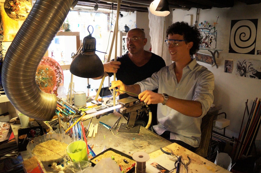 Artist working with glass in Venice