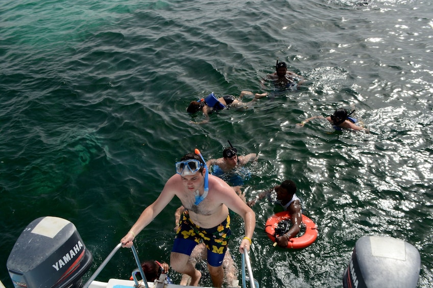 Group snorkeling off a party boat in the Caribbean