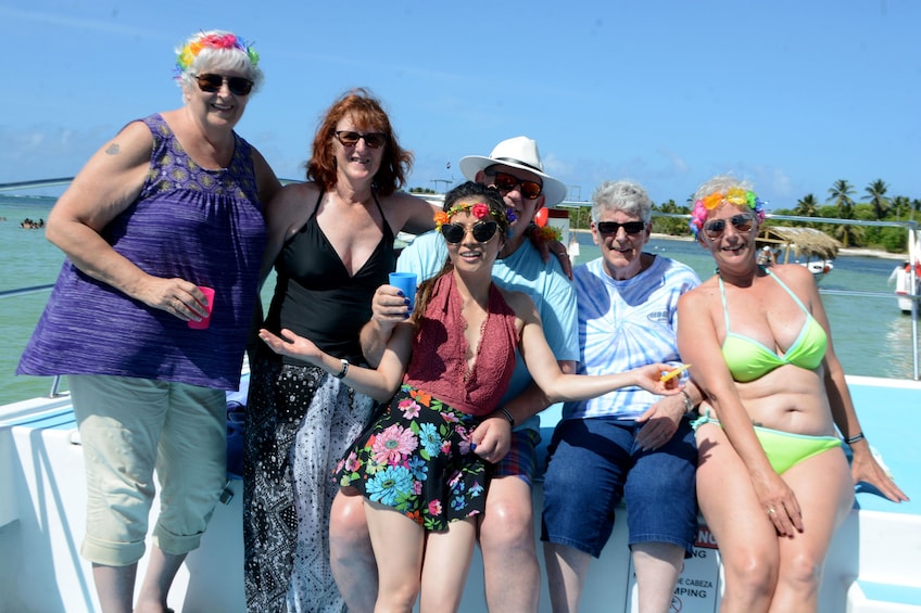 Family on a party boat with cocktails in the Caribbean