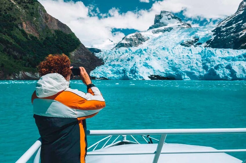 Woman taking a photo of the Spegazzini and Upsala Glaciers