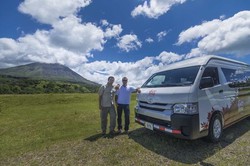 Men standing next to a tour van at Poás Volcano National Park