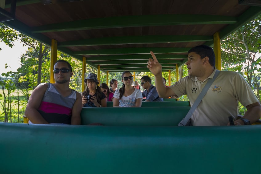 Group on a tractor-pulled wagon in Hacienda Nosavar