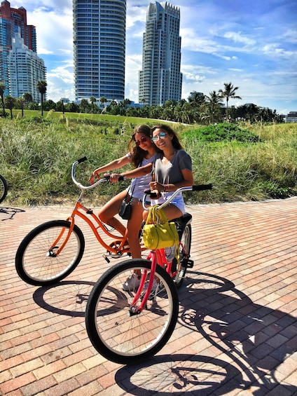 Women riding bicycles in a park in Miami