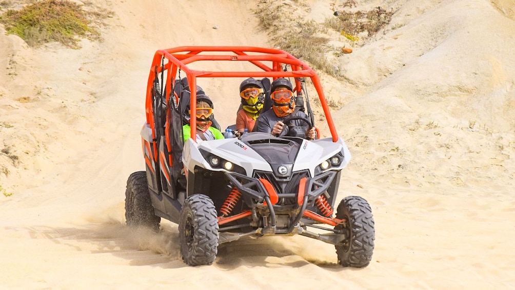Group in a UTV on the beach in Los Cabos