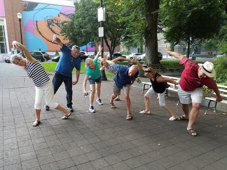 Show item 1 of 4. Group having fun on the Operation City Quest Scavenger Hunt