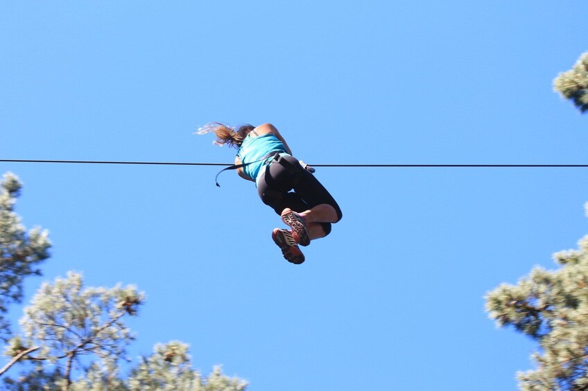 Ziplining woman in New Zealand