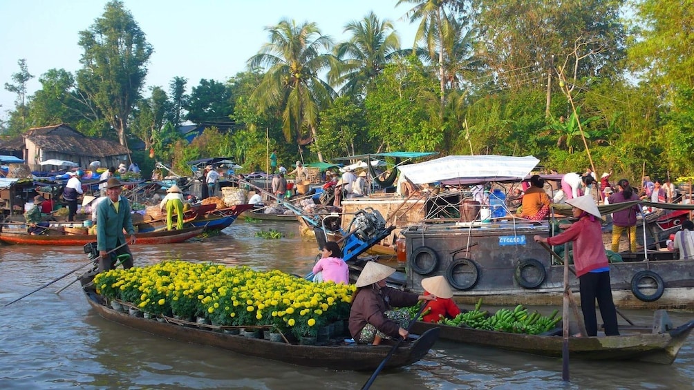 Boats full of flowers and vegetables at Cai Be Floating Market