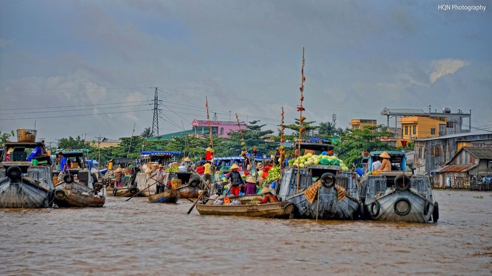 Panoramic view of colorful boats at Cai Be Floating Market in Vietnam