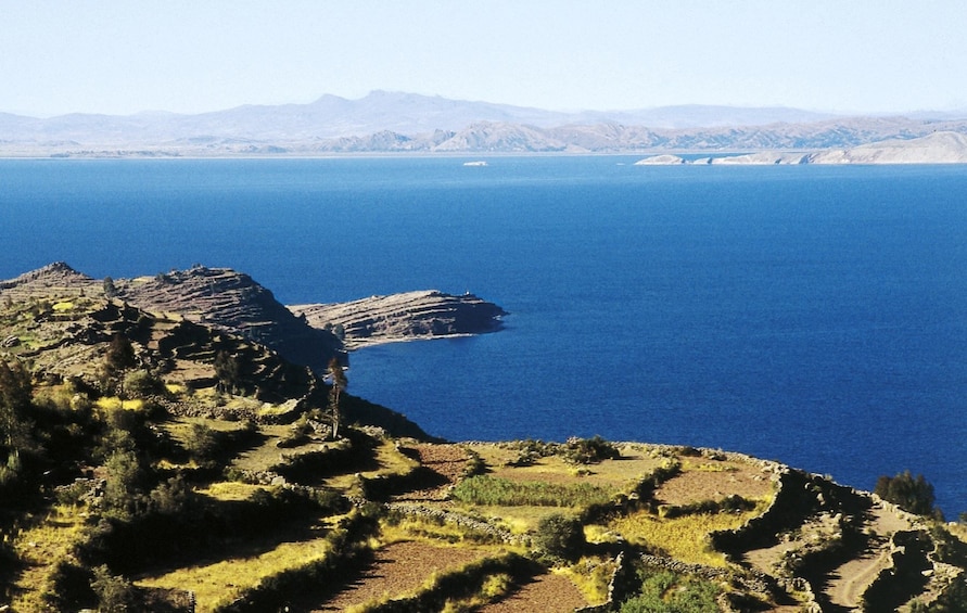 Panoramic view of Lake Titicaca and the land alongside it in Peru
