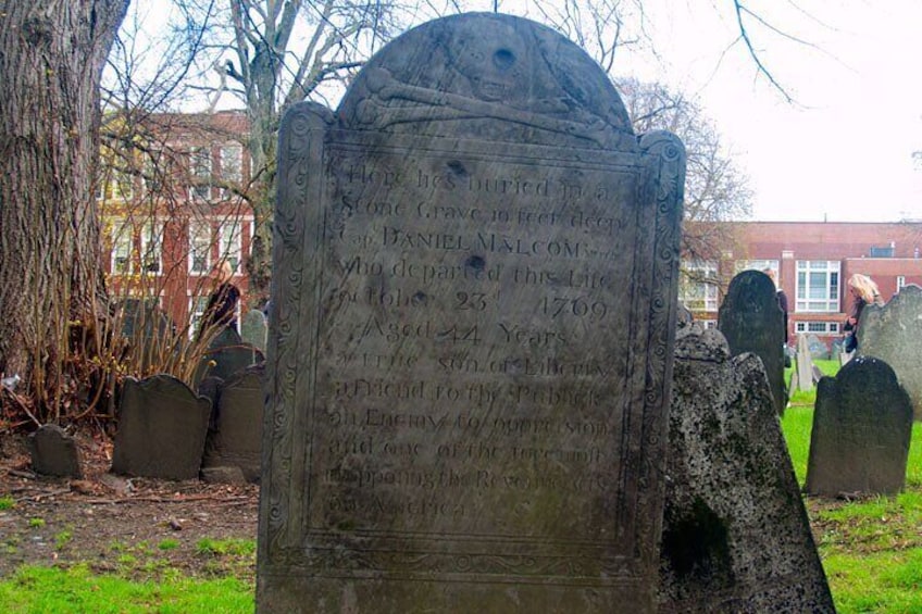 Daniel Malcomb's Headstone, pockmarked from musket balls.